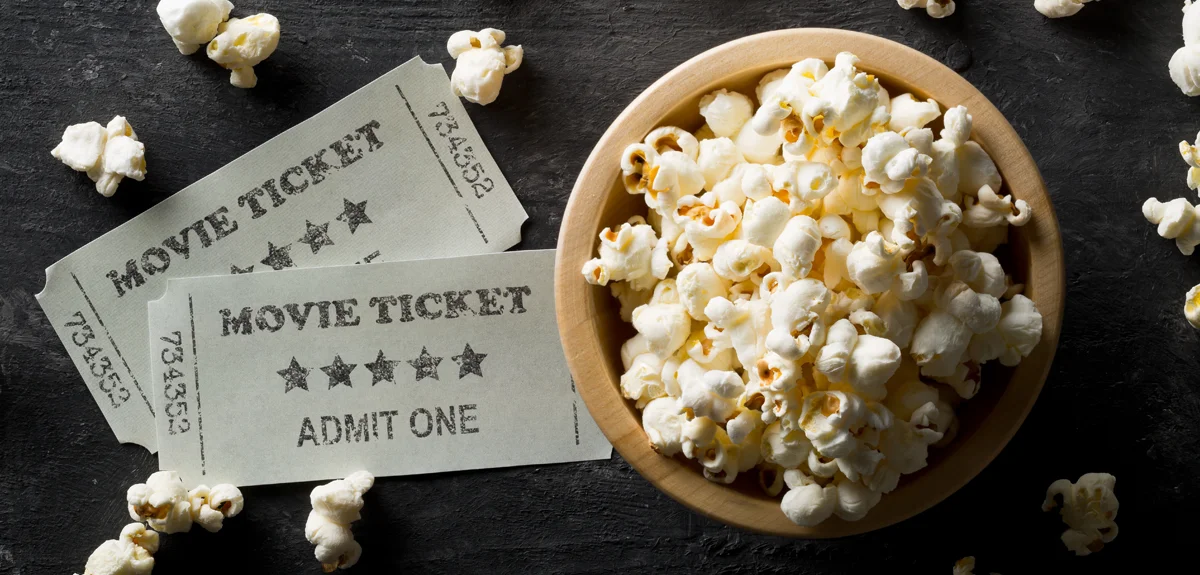 Cinema Promotion: bowl of popcorn with 2 movie tickets