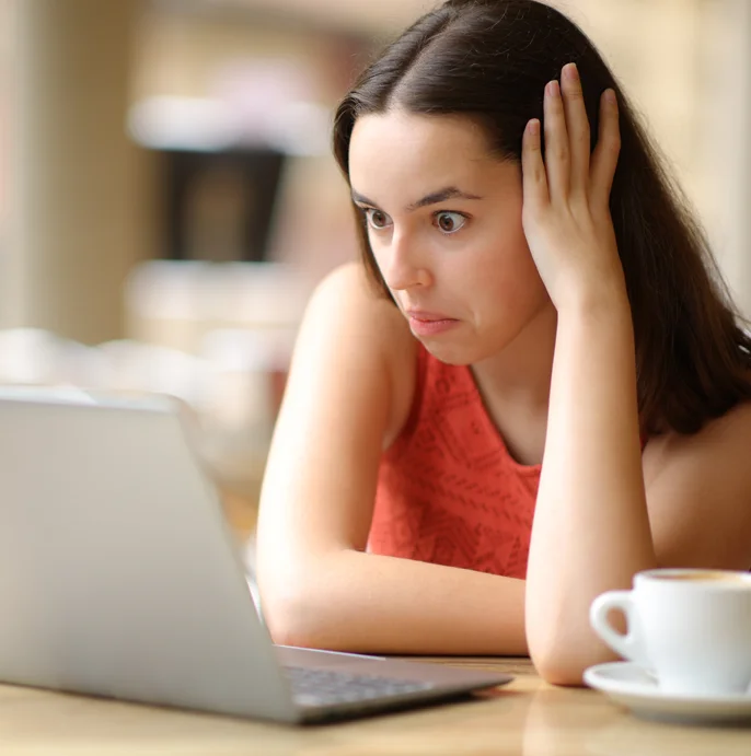 Brand partnerships insights: lady shocked at her laptop screen