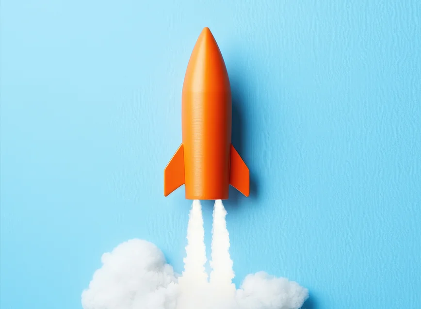 Sales Promotion Examples: orange rocket launching with a blue background