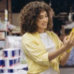 On Pack Promotion: Lady looking at product from shelf in store