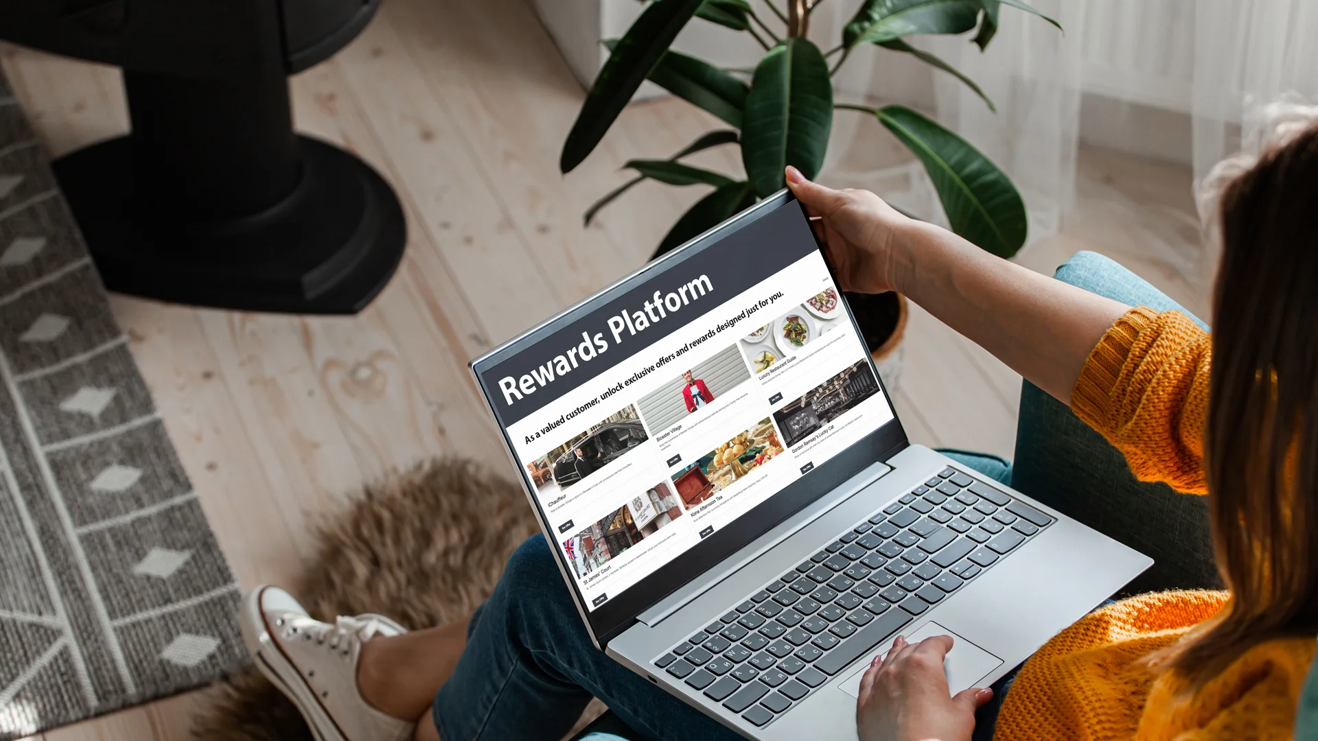 Reward and Incentive platform: lady using her laptop with a rewards platform on