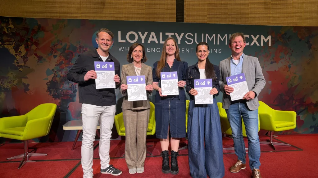Loyalty Summit CXM 2026: 5 experts from the Understanding Loyalty in Europe White Paper standing with the print in their hands
