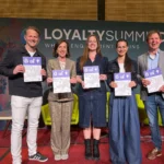 Loyalty Summit CXM 2026: 5 experts from the Understanding Loyalty in Europe White Paper standing with the print in their hands