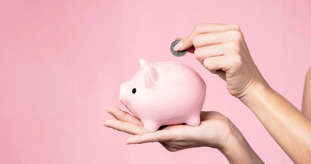 Most Effective Promotional Mechanics: Lady putting money back in her piggy bank to show a money back guarantee