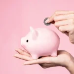Most Effective Promotional Mechanics: Lady putting money back in her piggy bank to show a money back guarantee
