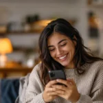 Rewards Improve Consumer Engagement: lady on her phone looking very engaged and happy