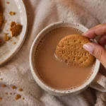 Favourite Brand Partnerships of 2026: A lady dipping a biscuit into her tea. An iconic partnership